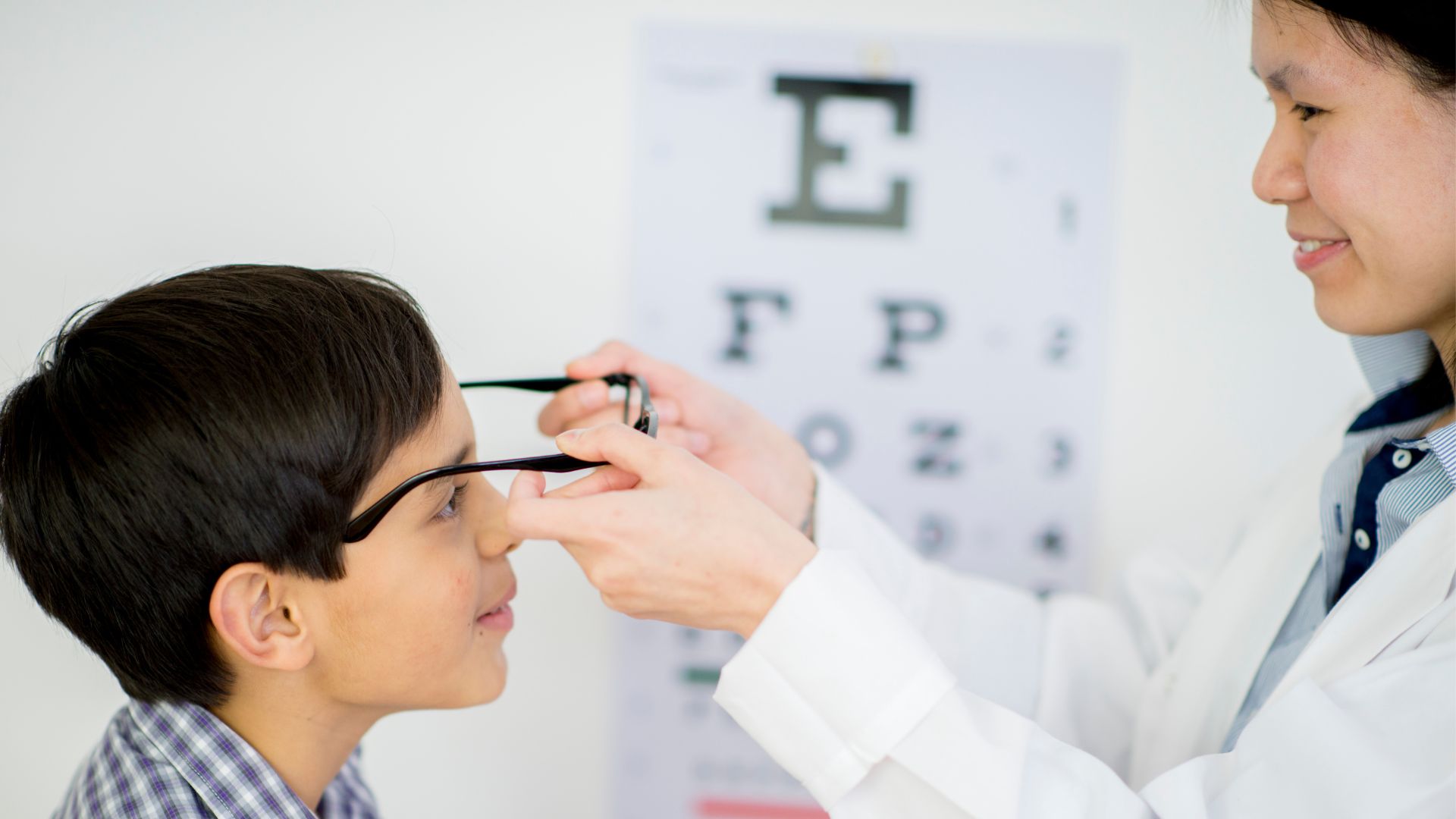 A well-lit, clean medical office setting with a desk, chairs, and a wall-mounted display showcasing various eye exercises. In the foreground, a person is performing a vision therapy exercise, focusing their gaze intently. The middle ground features an ophthalmologist observing and guiding the patient, their expressions calm and professional. The background depicts anatomical diagrams and charts related to the visual system, creating an educational and informative atmosphere. The lighting is soft and diffused, emphasizing the clinical yet approachable nature of the scene. Eye Exercises for Better Vision 01