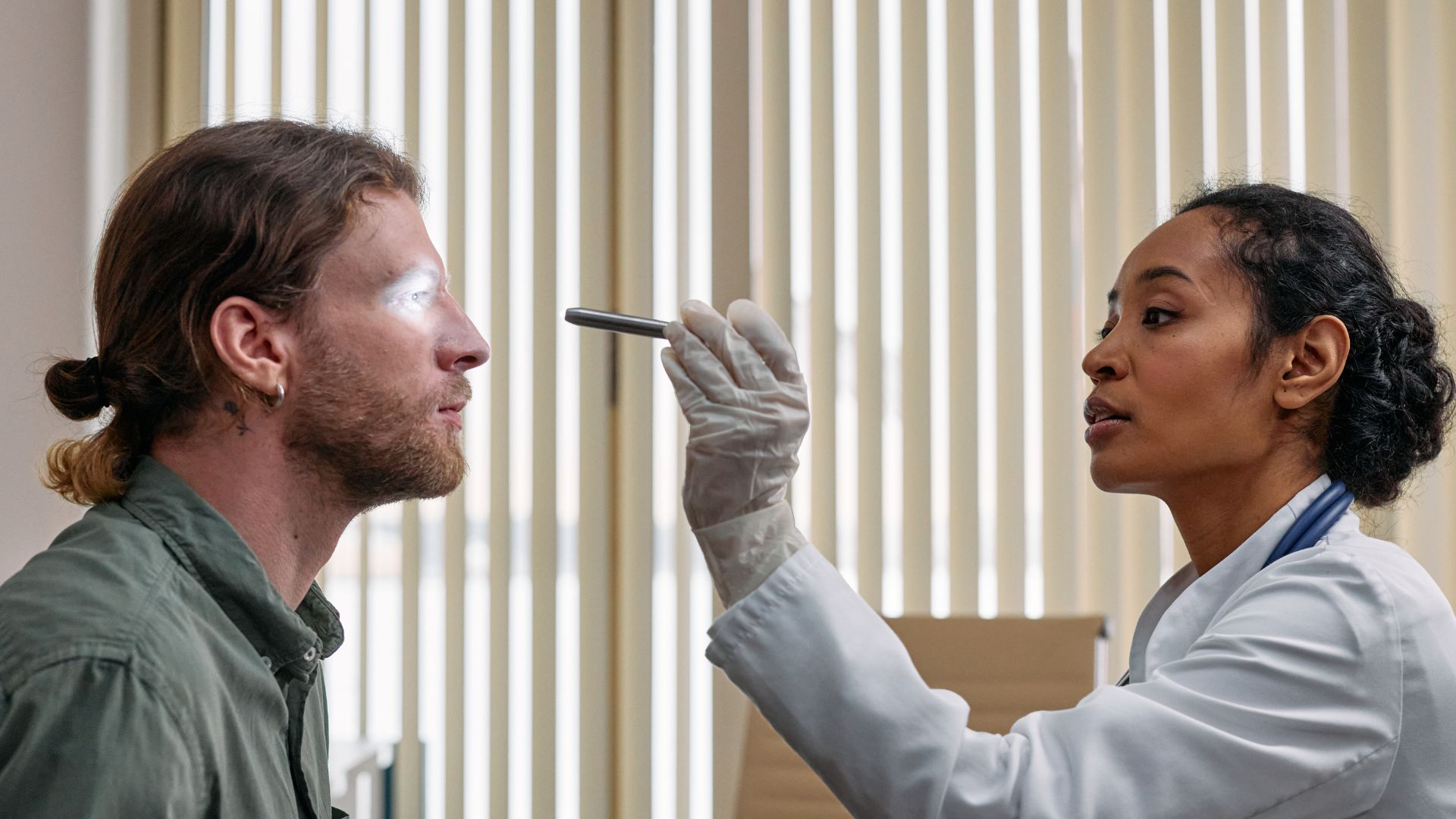 A brightly lit medical examination room, with a close-up view of a human eye undergoing various treatment options for eye floaters. In the foreground, the eye is prominently displayed, showcasing the transparent, wispy shapes of the floaters. In the middle ground, various medical instruments, such as a slit lamp, ophthalmoscope, and laser device, are visible, suggesting the different treatment methods available. The background features a clean, sterile environment, with white walls and subtle medical equipment, creating a sense of professionalism and expertise. The lighting is soft and natural, highlighting the intricate details of the eye and the treatment tools. The overall mood is one of reassurance and confidence in the effective management of this common visual condition. eye floaters 04
