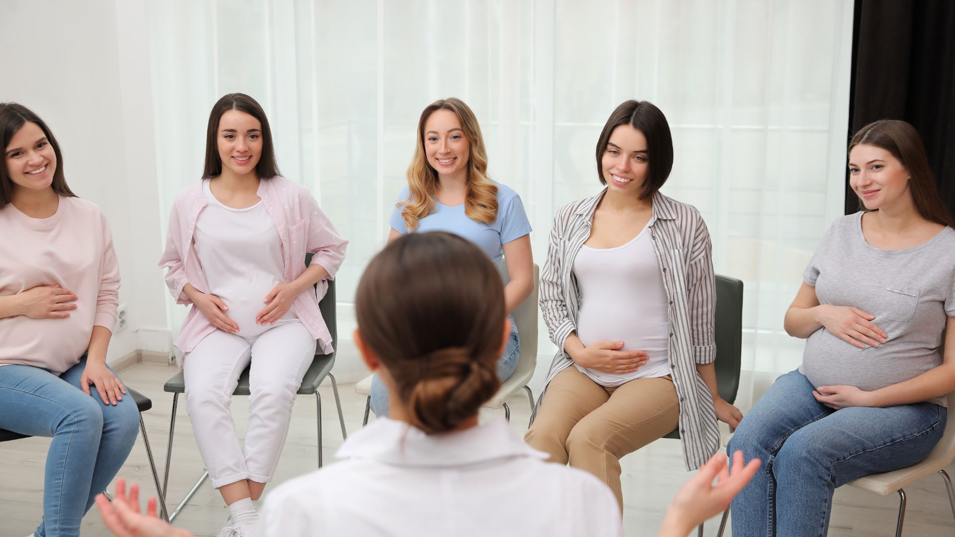 A pregnant woman sitting in a comfortable chair, surrounded by various eye health items such as glasses, eye drops, and a magnifying glass. The lighting is warm and natural, creating a calming and nurturing atmosphere. The woman's expression is serene, conveying a sense of self-care and attentiveness to her visual well-being during this special time. In the background, a soothing pastel-colored wall provides a serene backdrop, while subtle visual cues, such as a poster or pamphlet, suggest the theme of "Eye Care Tips for Expectant Mothers". pregnancy and vision changes 03