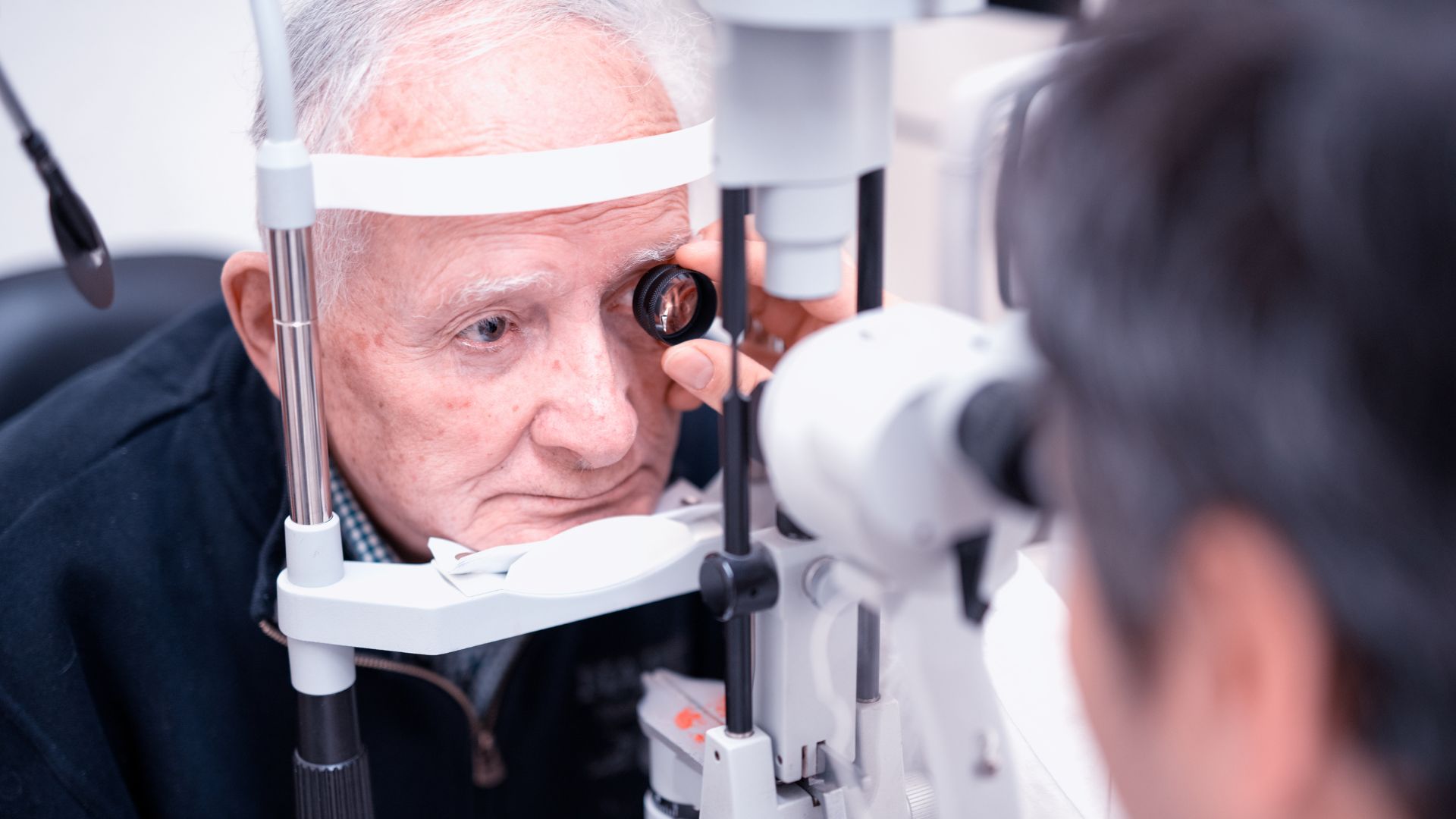 A well-lit medical examination room in a Canadian clinic, with an ophthalmologist carefully examining a patient's eyes using specialized equipment. The patient, an elderly Canadian individual, is seated comfortably while the doctor conducts a series of tests to assess potential glaucoma symptoms. The room is clean, sterile, and exudes a sense of professionalism and attention to detail. The doctor's expression conveys a deep concentration and concern, as they meticulously observe the patient's eye movements and responsiveness. The overall atmosphere is one of care, diligence, and a commitment to early detection and prevention of this prevalent eye condition within the Canadian population. understanding glaucoma 02